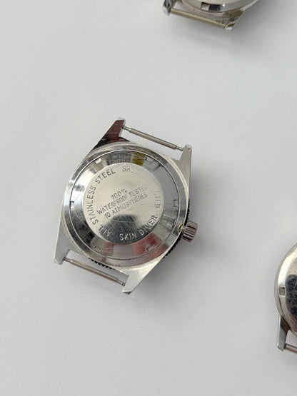 vintage Omega Seamaster cases and a diver case