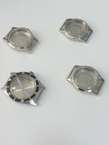 vintage Omega Seamaster cases and a diver case