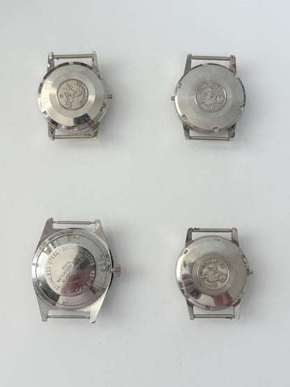 vintage Omega Seamaster cases and a diver case